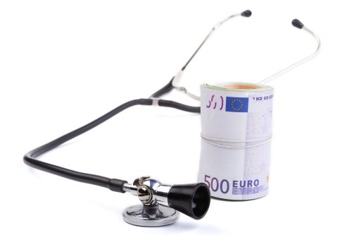 Stethoscope With Euro Black stethoscope closeup with euro isolated on white background